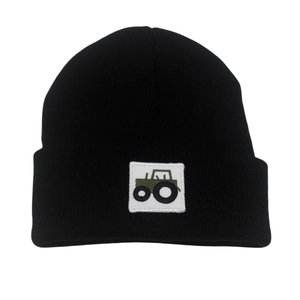 Black knitted baby beanie with green tractor patch and warm ear protection style