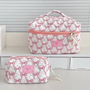 Quilted bow makeup bag set with large capacity case and small pouch on display