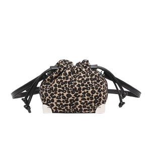 Leopard print drawstring bucket bag with black leather strap and silver metal corners