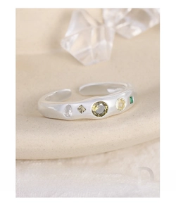 Macro detail of S925 sterling silver ring featuring inlaid colorful cubic zirconia stones