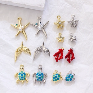 Detailed assortment of starfish, turtle and whale tail ocean-themed alloy jewelry charms