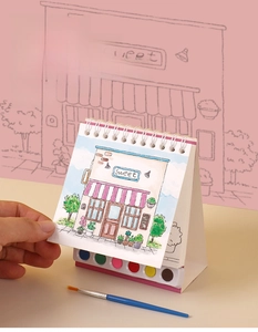 Detail of portable stand-up watercolor book with six-color paint palette and brush