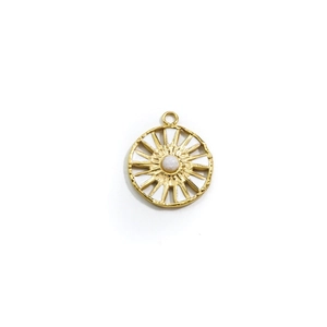 Macro shot of 14k gold stainless steel sunburst pendant with a white natural stone center