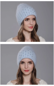 Detail view of light blue knitted beanie with soft rabbit fur texture and bead accents