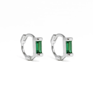 Macro shot of S925 sterling silver hoop earrings with rectangular green crystal