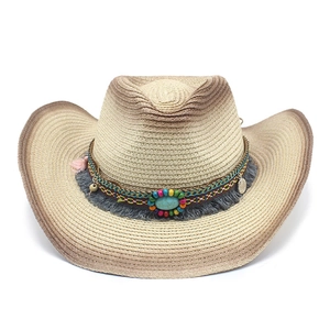 Western straw cowboy hat with bohemian turquoise beads, tassels and ethnic woven band