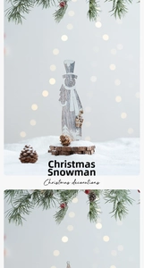 Macro view of a wooden Christmas snowman ornament with natural pine cones and a white scarf