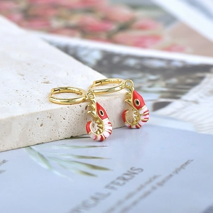 Detail showing S925 silver hallmark on red lobster drop earrings with gold hoop