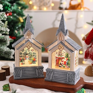 Close-up of lighted Christmas church figurine with intricate resin textures and LED glow