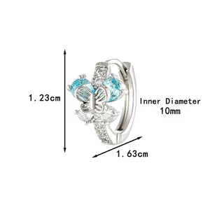 Créoles papillon en cuivre avec zircons bleu clair et détails en cristal blanc