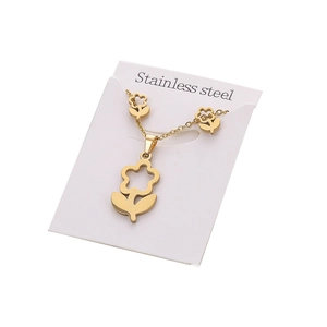 Golden stainless steel necklace and earring set with flower pendants on white display card