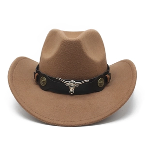 Detail of western cowboy hat featuring a leather band with silver longhorn bull skull emblem