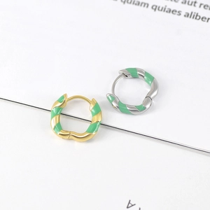 Minimalist S925 silver hoop earrings with green enamel spiral design on white background