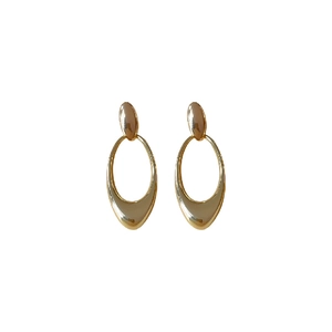 Polished gold metal oval hollow pendant earrings with minimalist geometric design