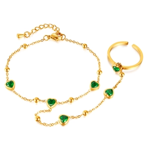 Gold stainless steel hand chain bracelet with green heart gemstones on white background