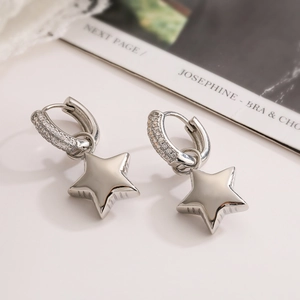 Chic silver star earrings with clear zircon pavé in a professional high-quality close-up