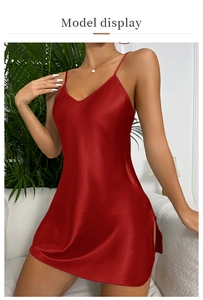 Close-up of a red satin slip dress featuring fine straps and a side slit detail