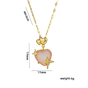 Gold-plated necklace with pink gemstone heart pendant and cross-star accents on white background