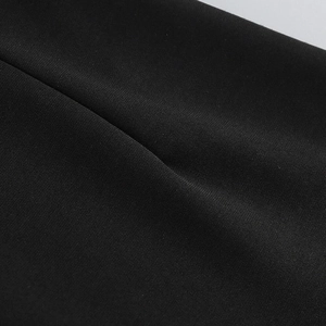 Detailed macro view of high-density black woven fabric texture with smooth draping effect