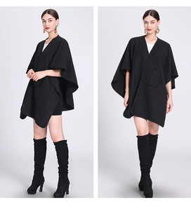 Detail view of deep grey wool blend poncho featuring a functional side pocket and open front