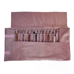 Detailed view of pink velvet jewelry roll organizer with hooks for 16 necklaces