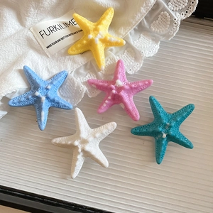 Detailed view of colorful resin starfish hair clips with realistic bionic texture