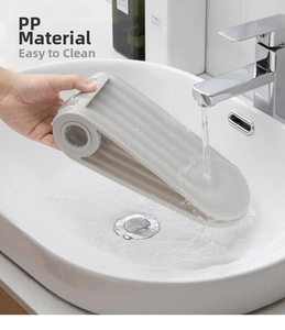 Detail of durable gray PP plastic shoe rack showing easy cleaning under running water