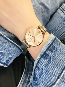 Close-up of GEDI rose gold ladies watch with Roman numerals and rhinestone markers