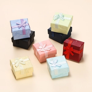 Colorful marble textured jewelry gift boxes with elegant ribbon bows for rings and earrings