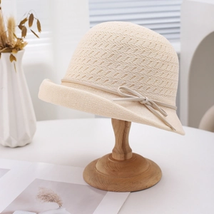 Breathable beige woven sun hat with roll-up brim and bow detail for summer