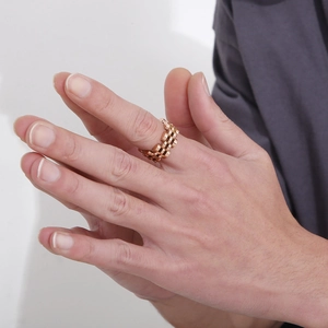 Detail of rose gold titanium steel ring with hollow watchband link design for men