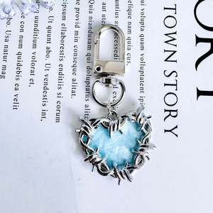 Blue marble heart keychain with silver barbed wire trim and metal lobster clasp