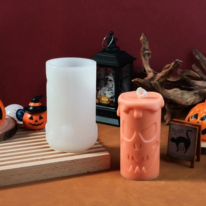 Detail of pumpkin face silicone mold for DIY Halloween candles and finished product