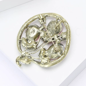 Detailed back view of golden alloy balloon brooch showing secure pin fastener mechanism