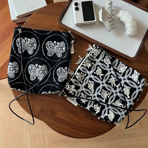 Handcrafted black canvas crossbody bags with detailed white butterfly and floral embroidery