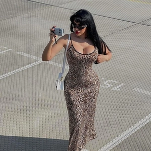 Detail view of a slim fit leopard print maxi dress with thin spaghetti straps and U-neck
