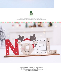 Macro detail of illuminated wooden NOEL letters with reindeer head and star ornaments