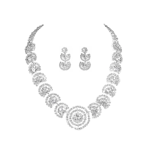 Luxurious sparkling rhinestone necklace and earrings bridal jewelry set on white background