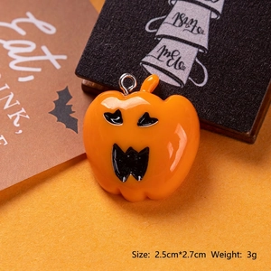 Detailed close-up of a 2.5x2.7cm glossy orange resin pumpkin charm for Halloween DIY crafts