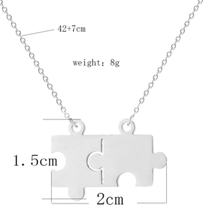 Detailed view of puzzle piece necklace showing exact size 2cm by 1.5cm and chain length info
