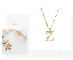 Detailed macro view of gold-plated O-chain necklace featuring micro-pave zircon Z pendant