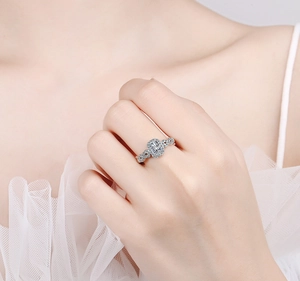 Elegant silver ring with rectangular zircon and side stones on model finger
