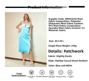 Détail de la robe en satin avec fente haute montrant la texture du tissu patchwork bleu et blanc