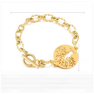 Detail of tree of life charm and OT toggle clasp on gold stainless steel bracelet