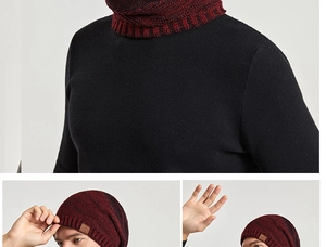 Détails de la maille du bonnet d'hiver rouge et noir avec écharpe et étiquette en cuir
