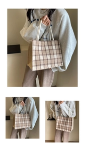 Detailed view of beige checkered canvas tote bag with nautical rope handles for women