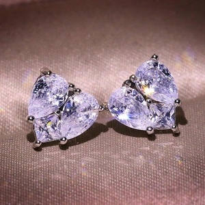 Sparkling heart stud earrings with three pear-cut cubic zirconia stones in silver setting