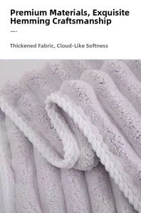 Close-up of thick coral fleece fabric with striped texture and reinforced edges