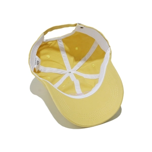 Detail view of the yellow cotton baseball cap interior showing 100% cotton sweatband
