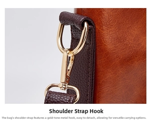 Detailed view of the golden metal strap clasp and premium leather texture of the bag.